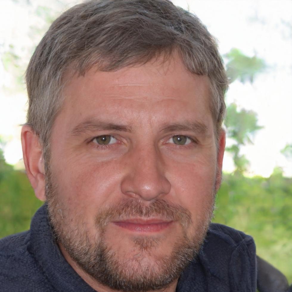 Professional headshot of experienced business finance instructor