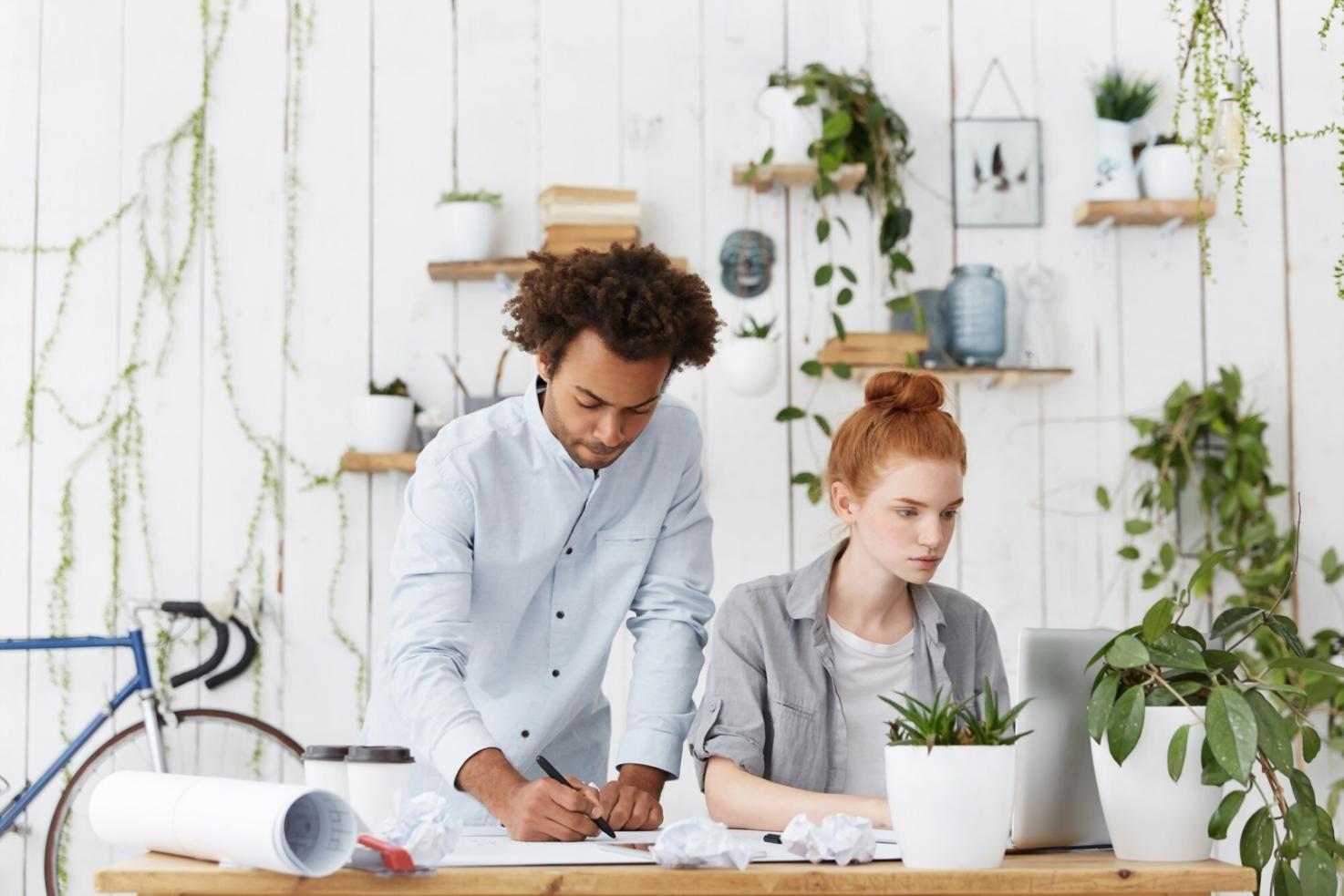 Business professionals reviewing financial documents and charts during a collaborative planning session