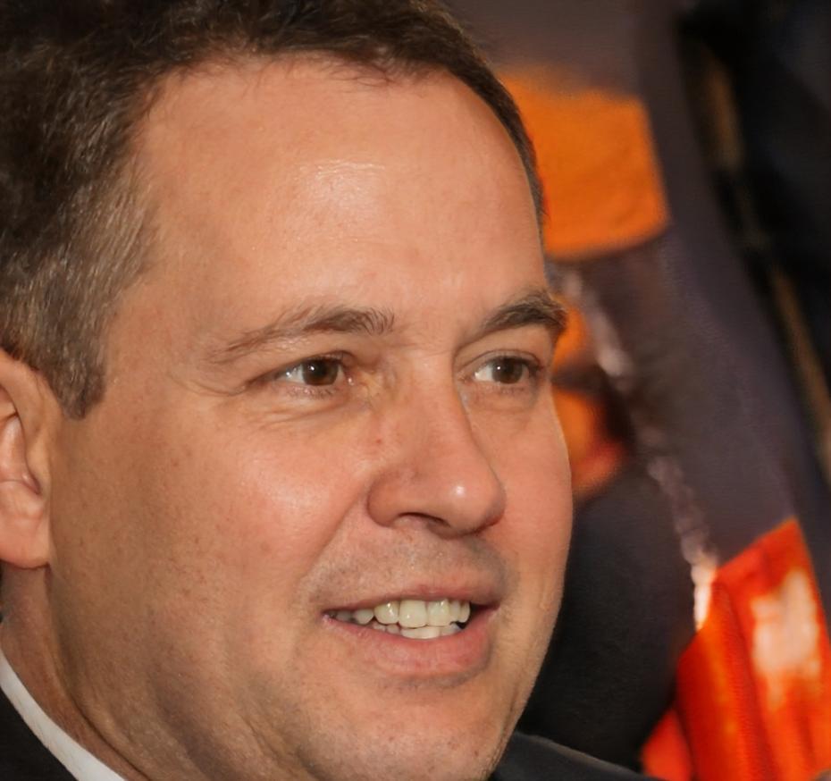 Professional headshot of experienced business finance instructor